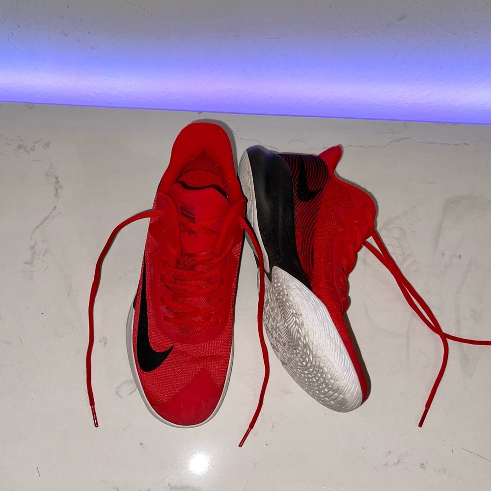 Red and black Nike shoes